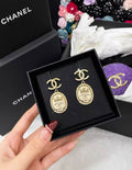 Chanel 21A Double CC gold crown earrings