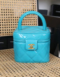 CHANEL 1995 VINTAGE "BARBIE" BLUE PATENT HEART-MIRROR VANITY CASE BAG