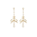 Chanel pearl / cc logo / bow tie drop earrings gold tone