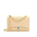 Chanel Maxi Classic Double Flap Bag Caviar beige