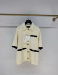 Chanel 24P polo écru & black igan