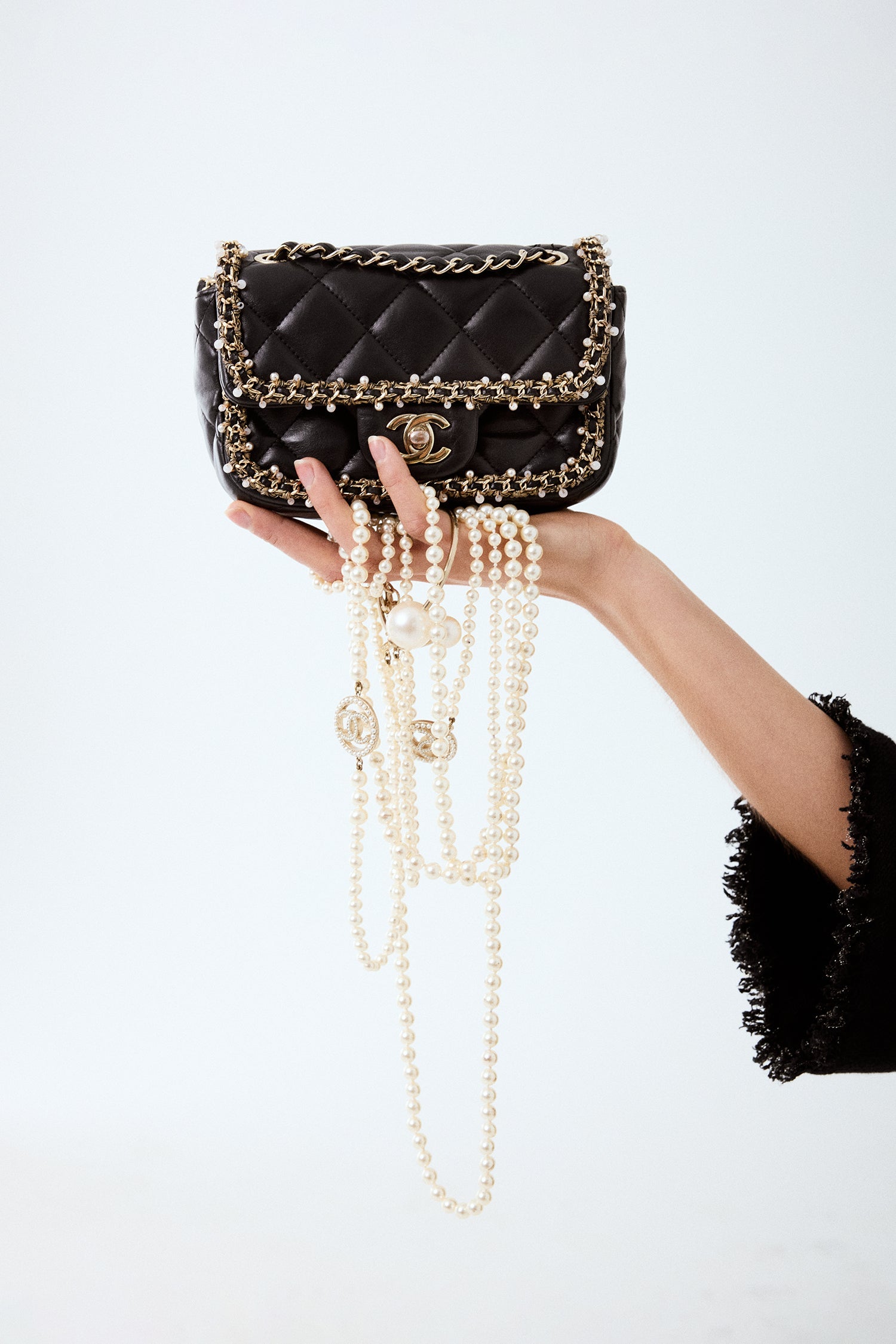 Pre-Loved Chanel™ Black Lambskin Pearl Chain Around Square Flap Bag
