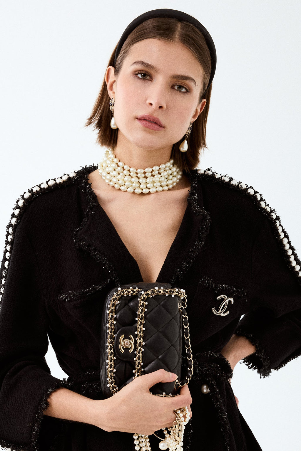 Pre-Loved Chanel™ Black Lambskin Pearl Chain Around Square Flap Bag