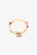 Pre-Loved Chanel™  Gold Tone Pink Beaded CC Charm Bracelet