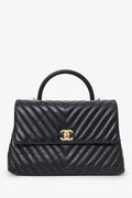 Pre-Loved Chanel™ Black Leather Chevron Coco Top Handle With Strap