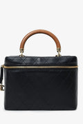 Pre-Loved Chanel™ Black Quilted Lambskin Knock On Wood Vanity Case