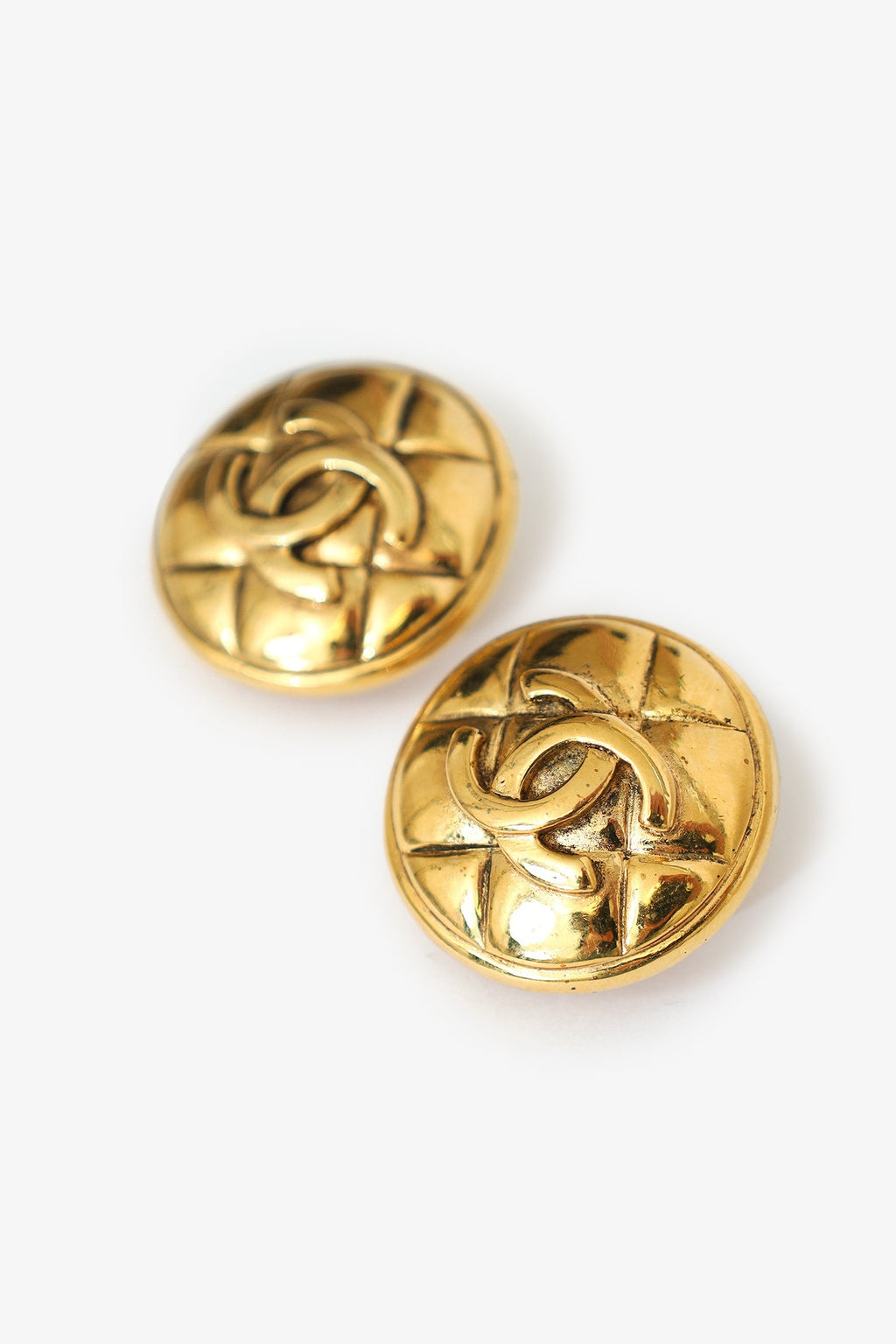 Pre-Loved Chanel™ Gold-tone Quilted Coco Mark Matelassé Round Clip-on Earrings