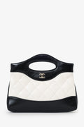 Pre-Loved Chanel™ 2023 Black/White Shiny Crumpled Calfskin Quilted Nano 31 Shopping Bag