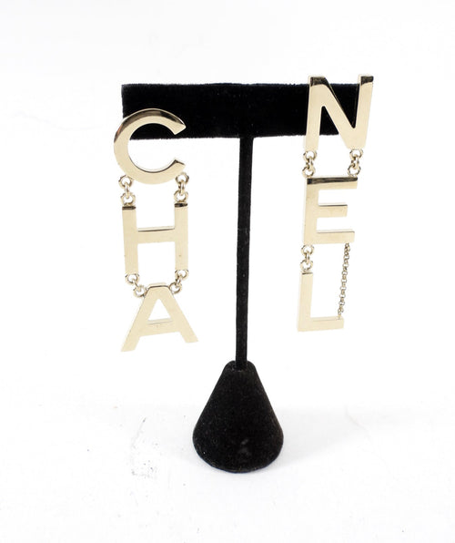 Chanel 19S Light Goldtone Spellout Logo Drop Earrings