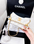 Chanel 24A pearl handle white leather chain bag