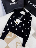 Chanel 23AW black camellia off-shoulder bow top