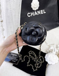 Chanel black camellia round chain bag